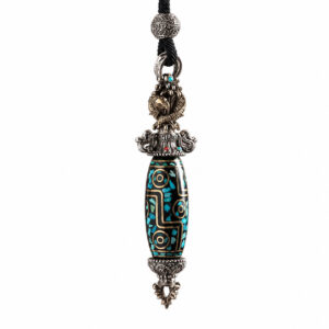 Ornate pendant necklace with a turquoise-inlaid bead and silver filigree caps on a black cord strap.