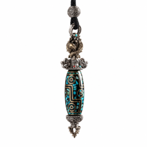 Ornate pendant necklace with a turquoise-inlaid bead and silver filigree caps on a black cord strap.