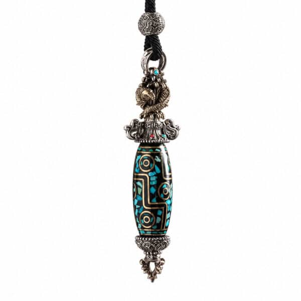Ornate pendant necklace with a turquoise-inlaid bead and silver filigree caps on a black cord strap.