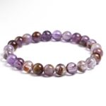 Purple amethyst bead bracelet on a white background, elastic string visible between beads to show stretch design